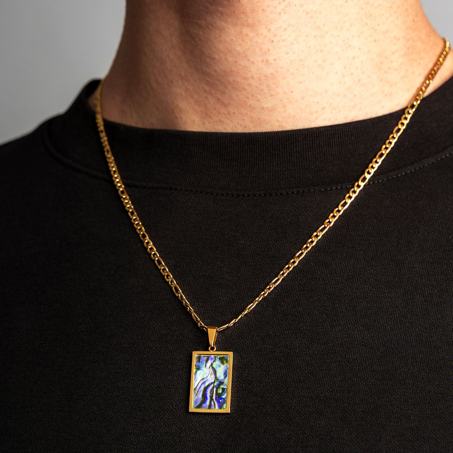 Our Premium Rectangle Pendant paired with our Signature Figaro Chain is the perfect touch of Gold & Opal.